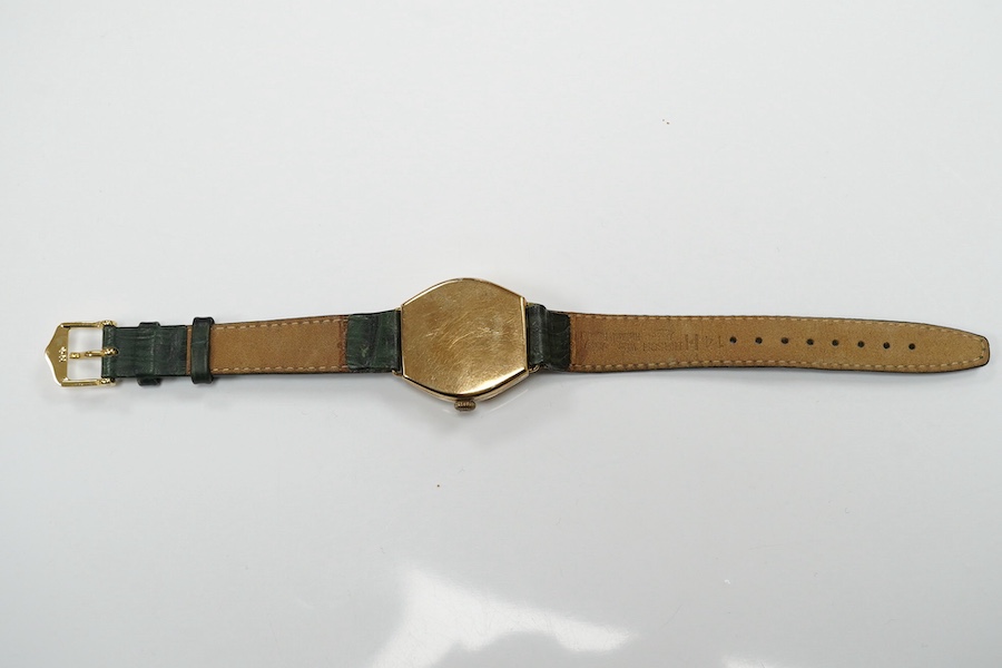 A gentleman's 1950's 9ct gold manual wind wrist watch, with Roman dial, signed Rolex movement, with Aaron Lufkin Dennison case, case diameter 29mm, on an associated leather strap. Condition - poor